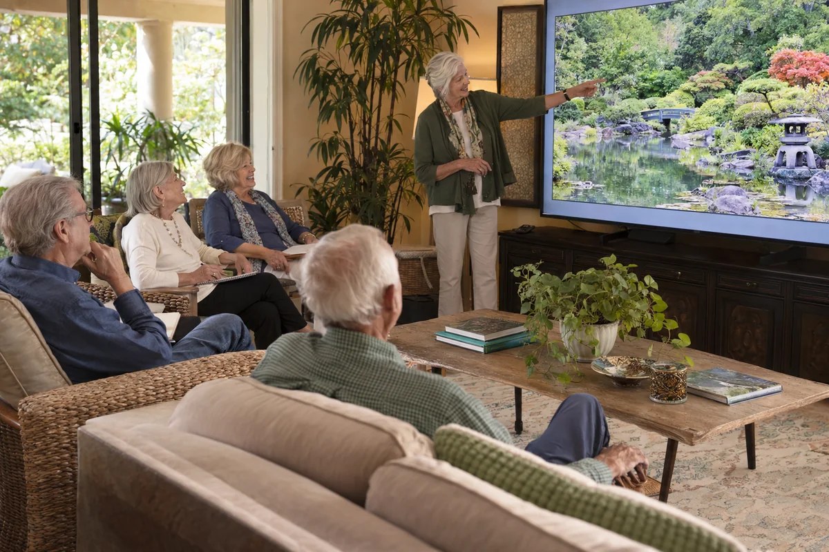 A group exploring beautiful gardens through an illustrated talk